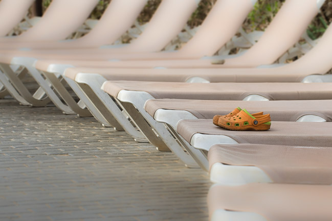 A pair of child's beach shoes left on a sun lounger, Boa Vista, Cape Verde