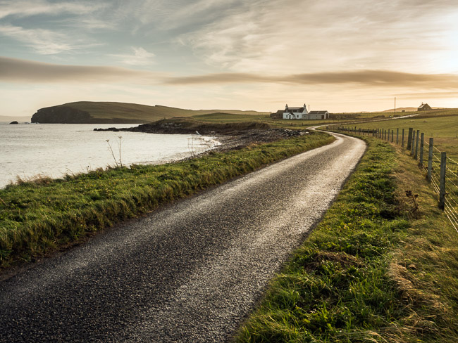 View down road at dawn, Melby, near Sandness, Shetland